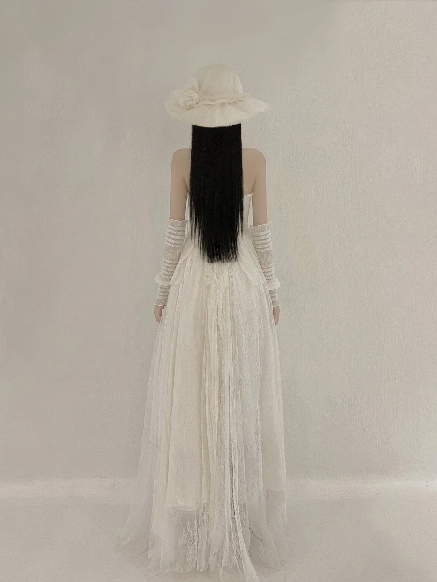 White lace-up top and skirt set with sleeves